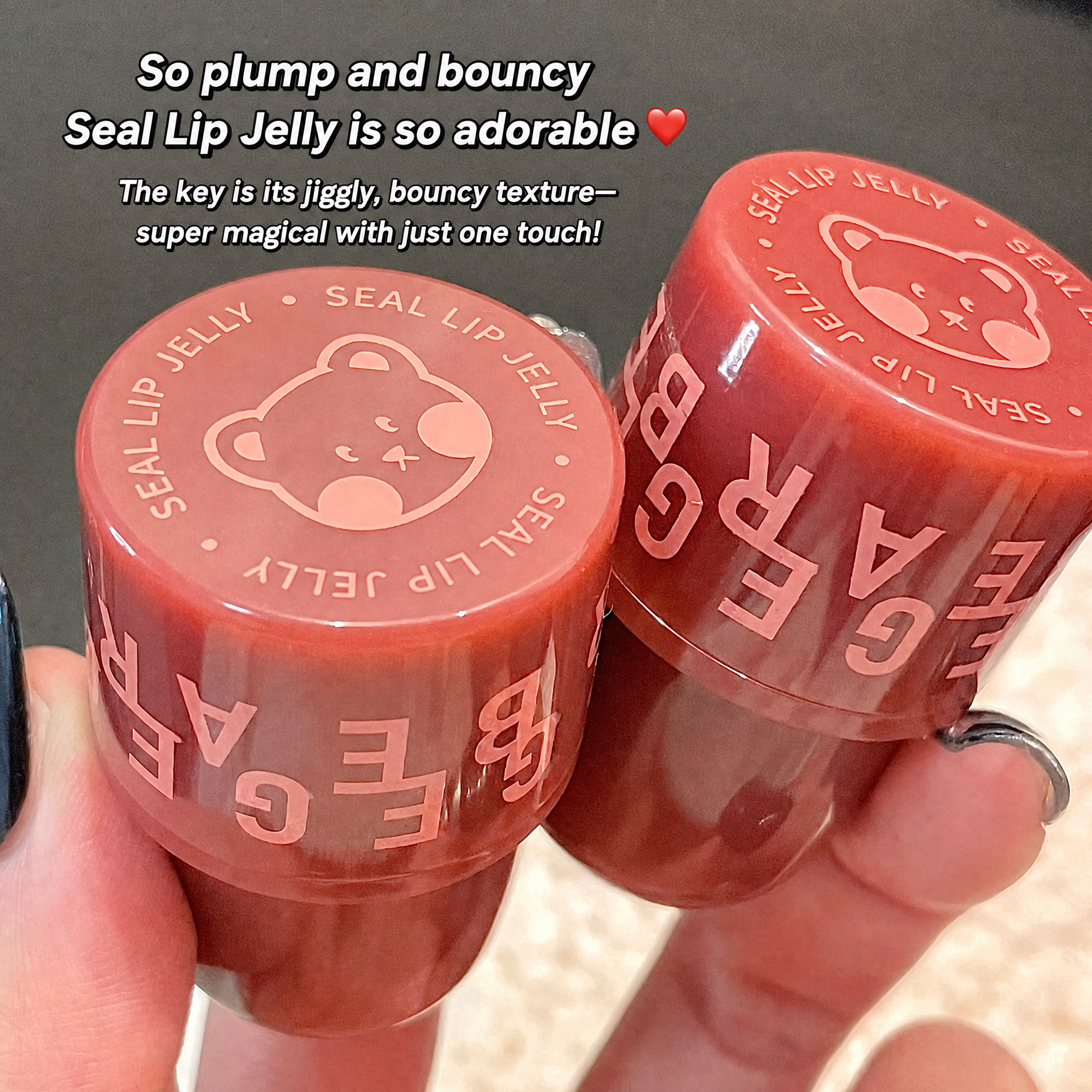 Two red lip jelly containers with visible text and branding, held by a person.