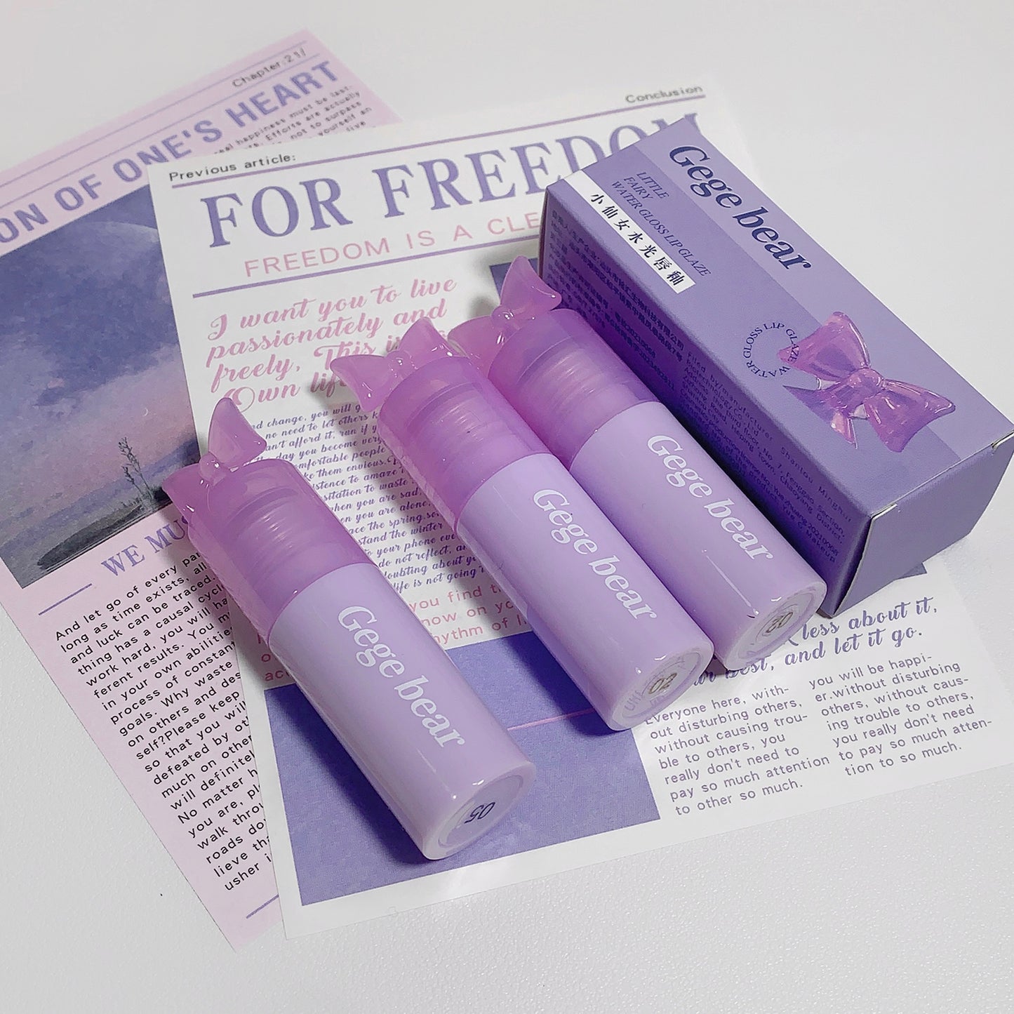 Purple 'Gege bear' products on a newspaper background