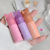 Three Gege bear products held in a hand with a soft focus background