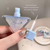 Small applicator with silicone head design, suitable for drawing fine lines, held by a hand.