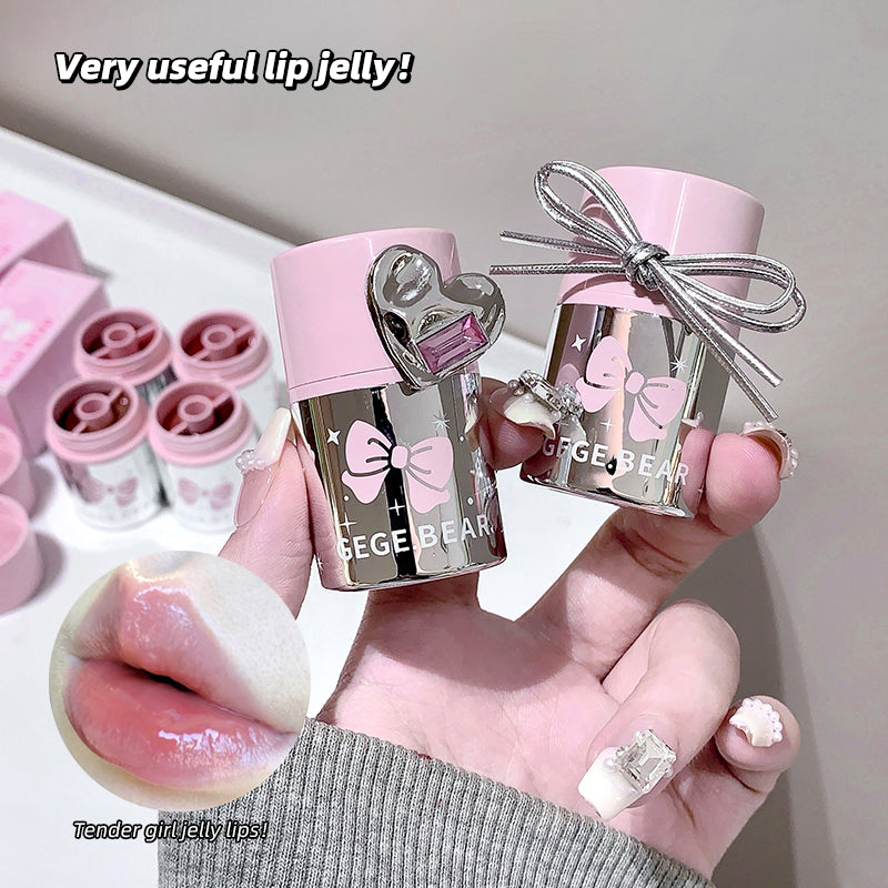 Two lip jelly products with bows held by a hand, labeled 'Gige Bear', on a light gray background.