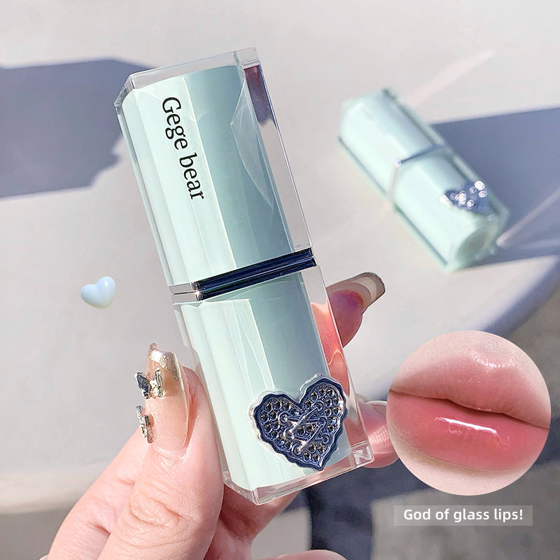 Lip gloss with 'Gege bear' branding held by a hand, close-up of lips with gloss applied.