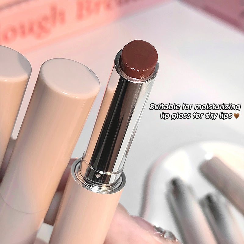 Lip balm with a silver cap on a white background