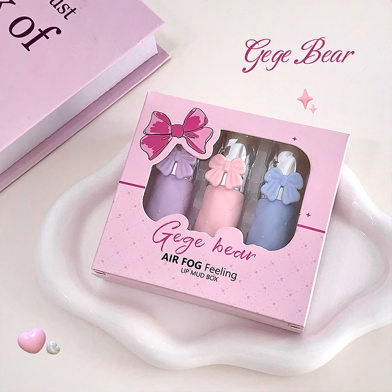 Gege Bear lip mud box with three lip products on a light pink background