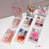 Set of makeup palettes with colorful shades on a white surface