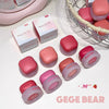 Pink and red cosmetic products with 'GEGE BEAR' branding on a white surface.