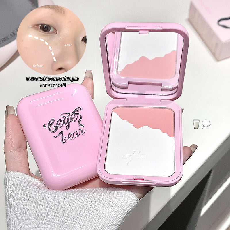 Pink compact mirror with 'Bego Bear' branding, held by a hand, with a close-up of skin before and after application.