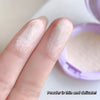 Close-up of a finger with light-colored powder applied, showing its thin and delicate texture.