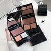 Makeup palette with Gegebear branding held by a hand on a white surface.