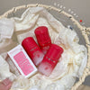 Red skincare products with a box on a white fabric background, branded 'Gege Bear'.