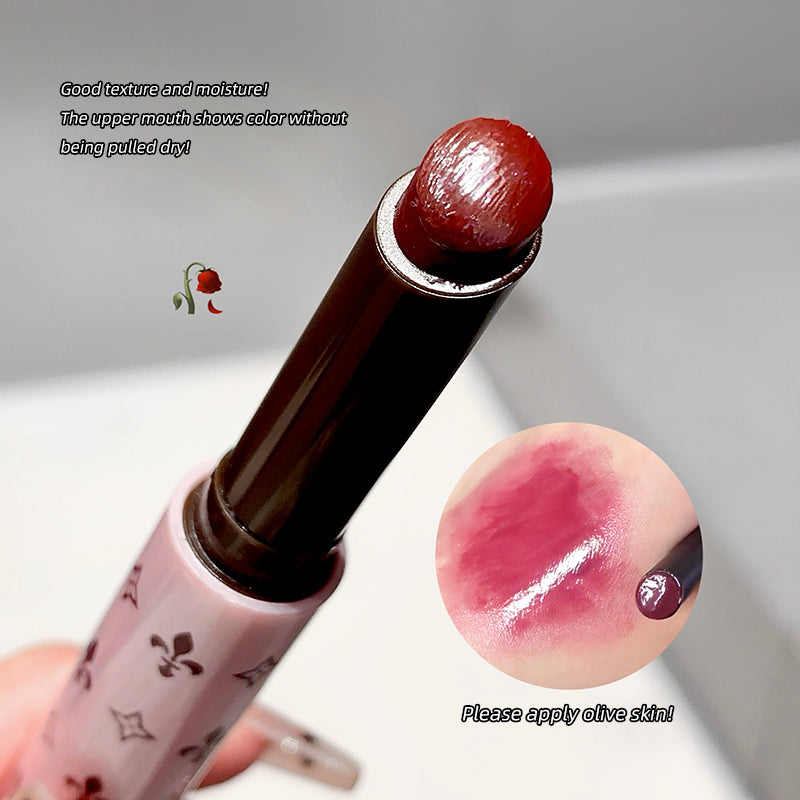 Lipstick with a close-up of the color on skin, on a neutral background