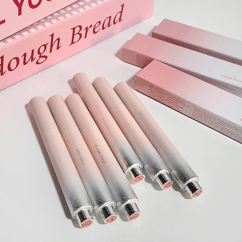 Set of gradient lipsticks with packaging on a light background