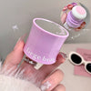 Purple container with 'Gege bear' branding held by a hand, with a small inset showing the product.