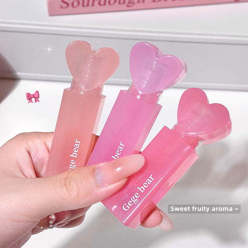 Three pink heart-shaped containers with 'Gege bear' branding held by a hand.