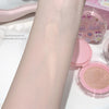 Cosmetic product applied to arm with packaging in the background