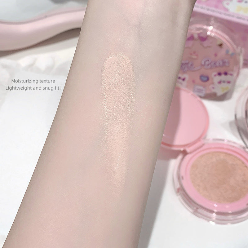 Cosmetic product applied to arm with packaging in the background