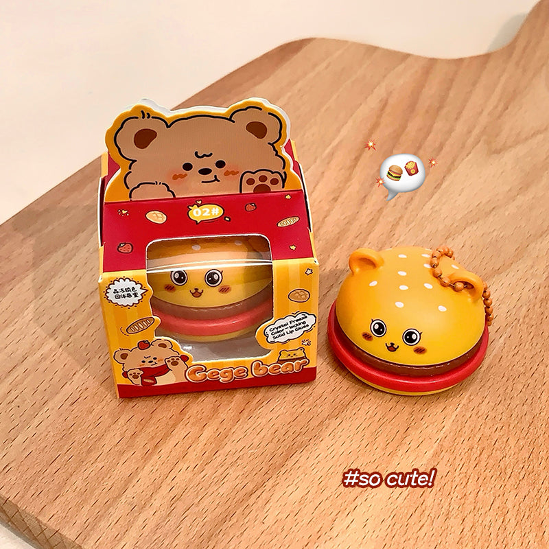 Cute yellow and red toy with packaging on a wooden surface, featuring the text '#so cute!'.