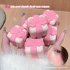 Pink lip and cheek dual-use cream with decorative bows held by a hand.