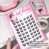 False eyelashes packaging with a close-up of an eye wearing them, on a white surface.