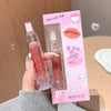 Lip gloss with packaging held by a hand, brand 'GEGE BEAR' visible