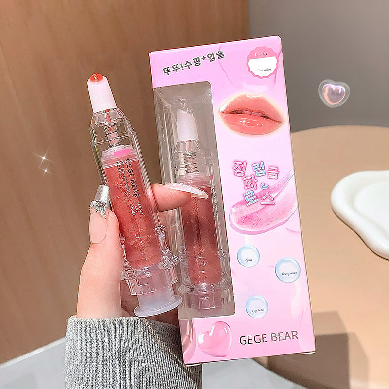 Lip gloss with packaging held by a hand, brand 'GEGE BEAR' visible