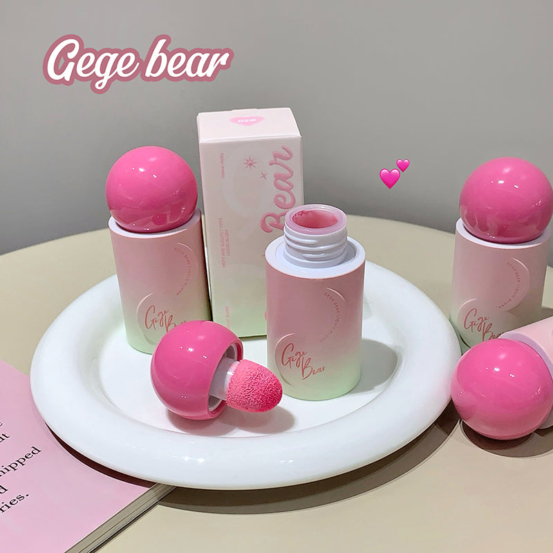 Pink cosmetic set with 'Gege bear' branding on a white plate.