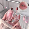 Pink lip tint with applicator held by a hand, close-up of lips with product applied.