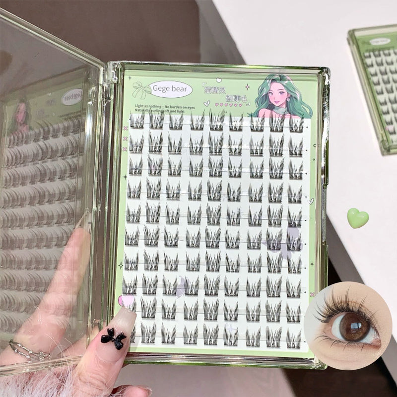 Eyelash extension tray with a hand holding it, showing close-up of eyelashes.