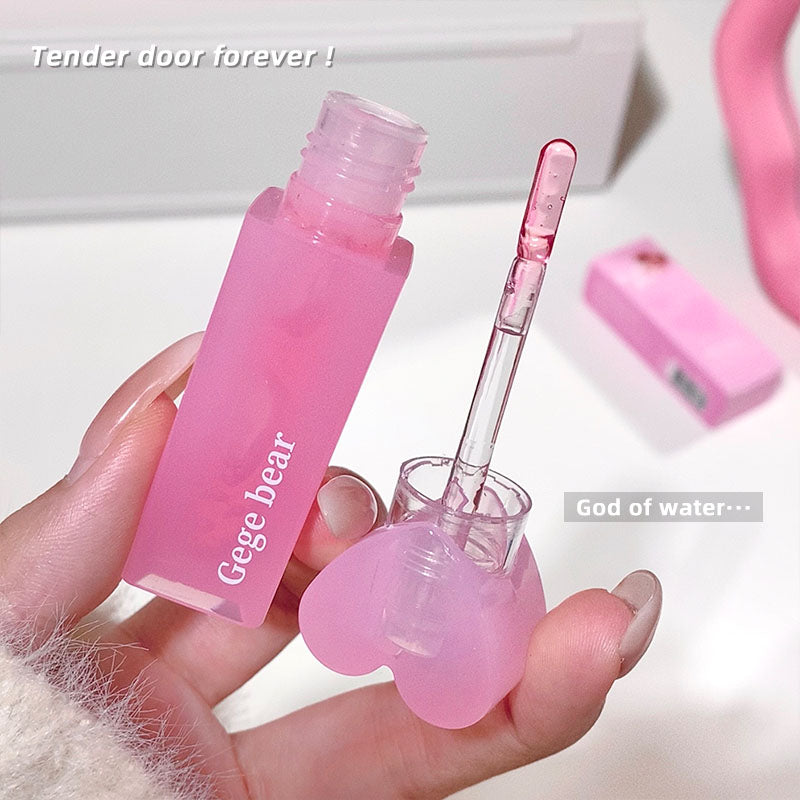 Pink cosmetic bottle with applicator held in a hand, with text 'Tender door forever!' and 'God of water.