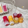Set of Gege bear skincare products on a white surface with a basket in the background.