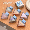 Gege Bear makeup products on a wooden surface