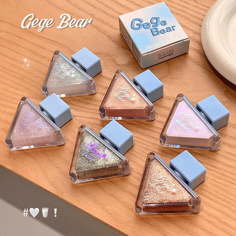 Gege Bear makeup products on a wooden surface