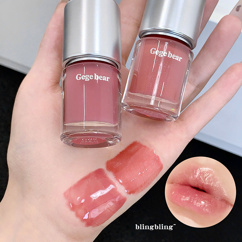 Two bottles of 'Gege bear' lip gloss on a hand with swatches and a close-up of lips.
