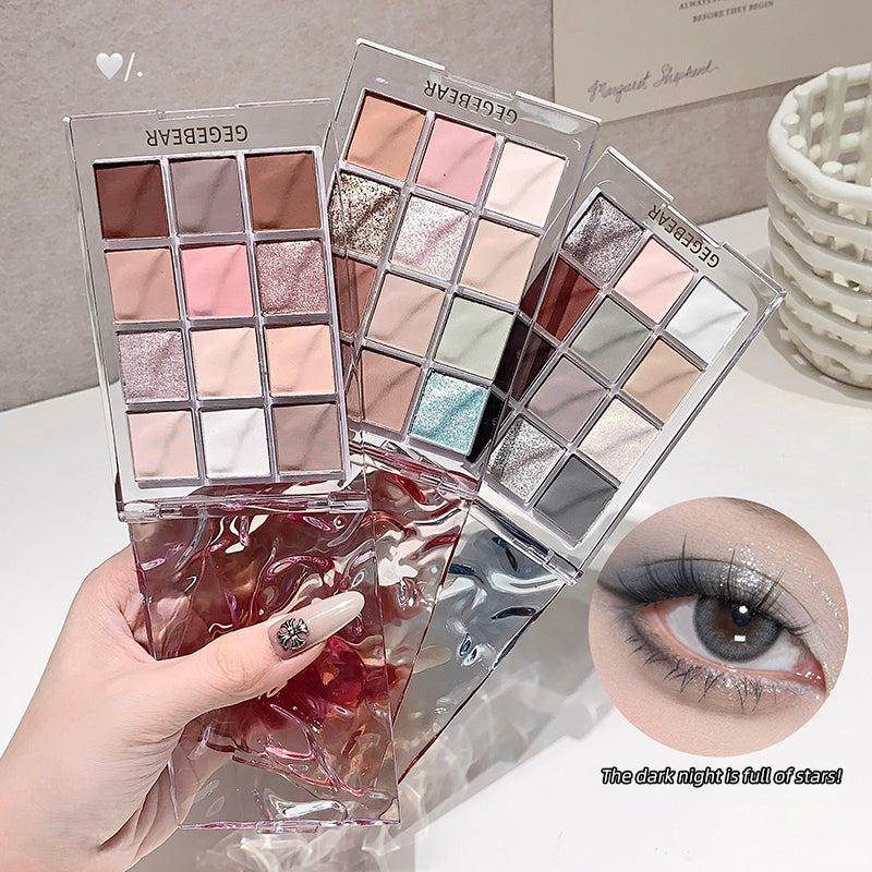 Makeup eyeshadow palettes with a hand holding one and an inset of an eye wearing the makeup.