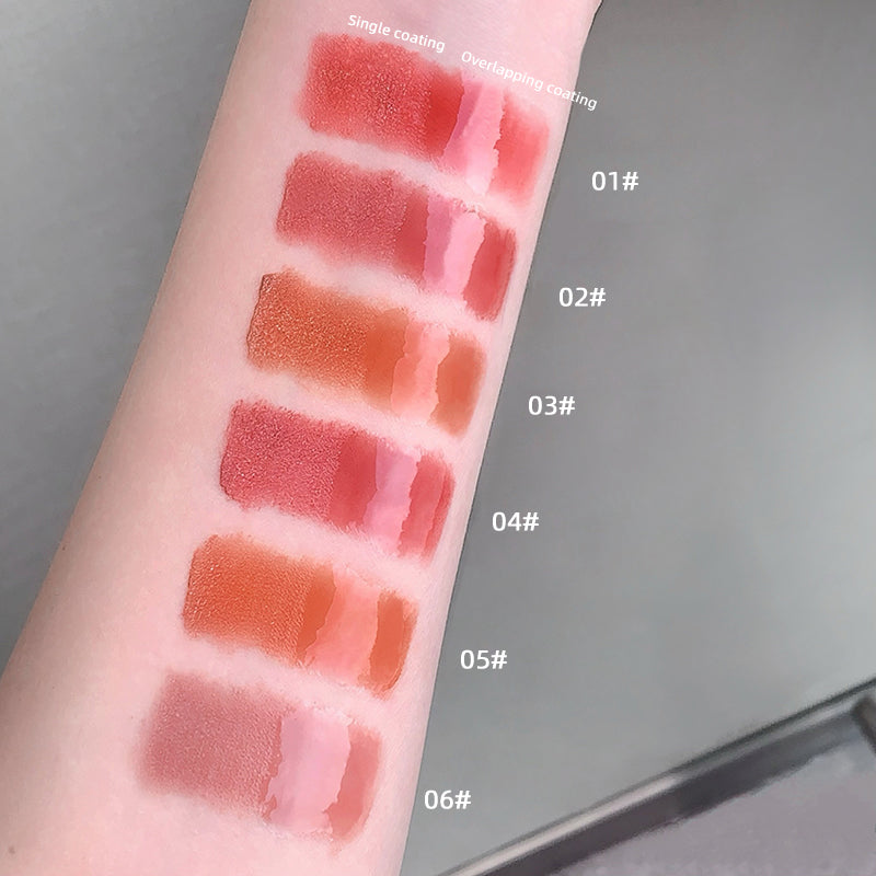 Lipstick swatches on a person's arm with color codes