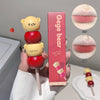 Lip balm with bear design and packaging labeled 'Gege bear' on a neutral background.
