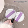 Two white makeup sponges with purple 'Gege bear' ribbons in clear packaging.