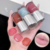 Three lip glosses with their swatches on a hand and close-up of a lip.