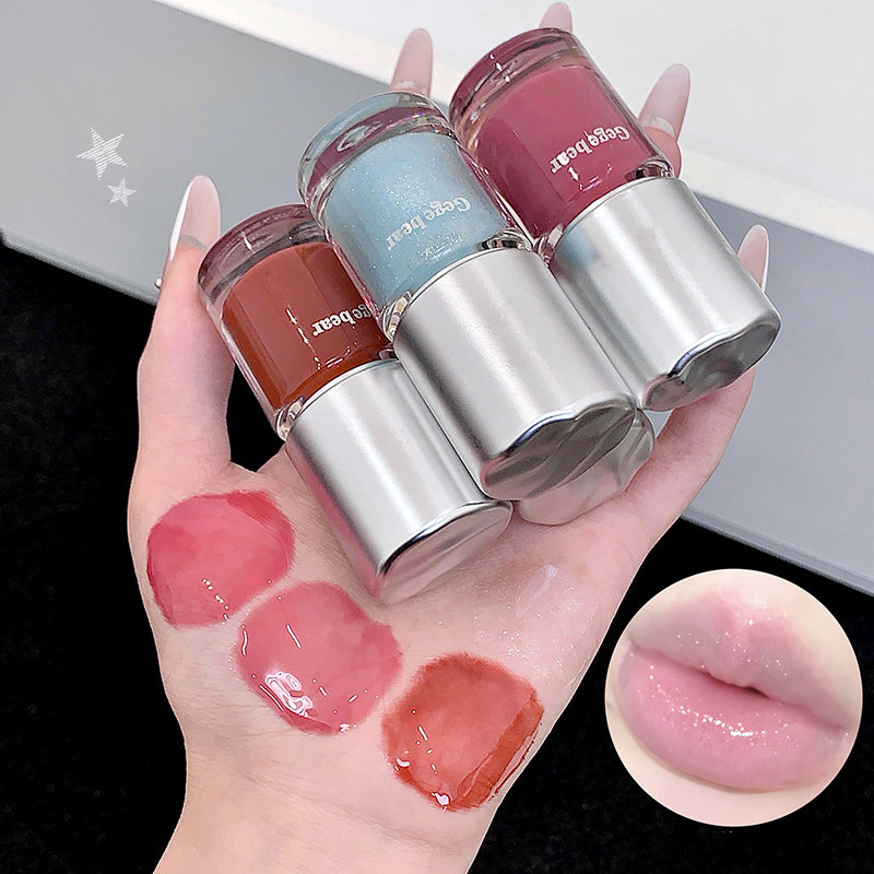 Three lip glosses with their swatches on a hand and close-up of a lip.