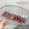 Set of lip balms in various colors displayed in a metal basket with 'GEGE BEAR' branding.