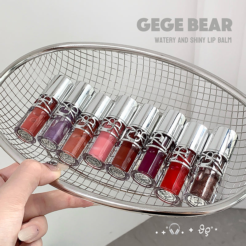 Set of lip balms in various colors displayed in a metal basket with 'GEGE BEAR' branding.