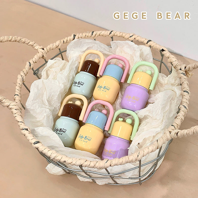 Colorful baby teething toys in a woven basket with 'GEGE BEAR' branding.