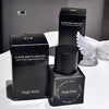Black Gege bear foundation bottle and packaging on a white surface with a gray background
