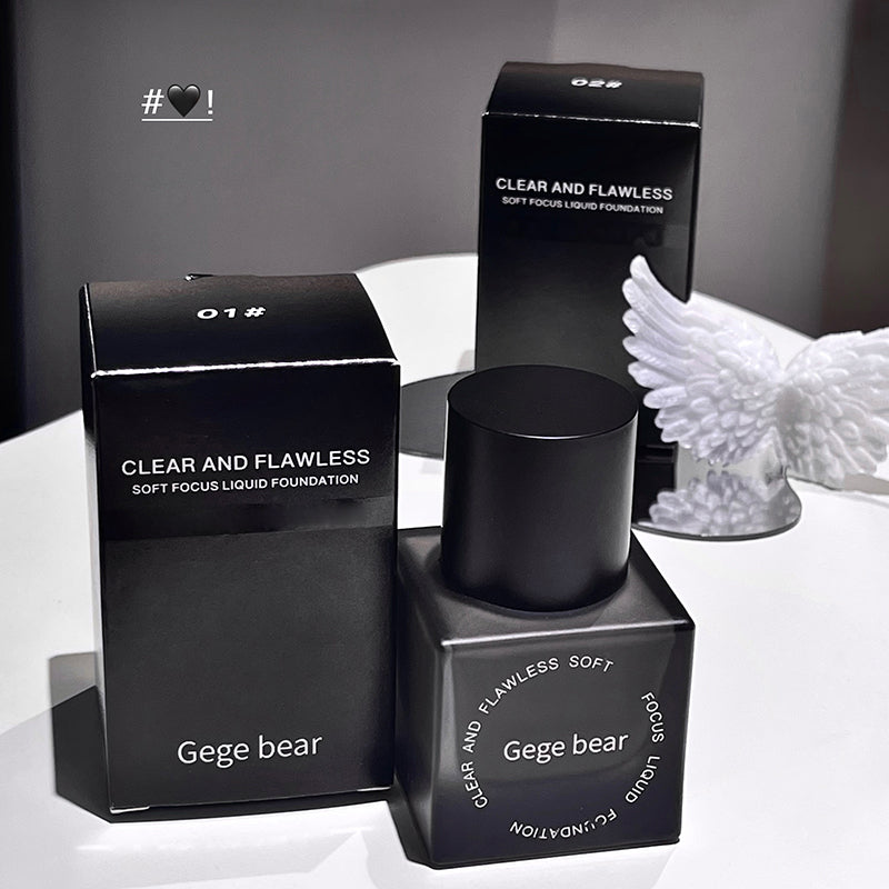 Black Gege bear foundation bottle and packaging on a white surface with a gray background