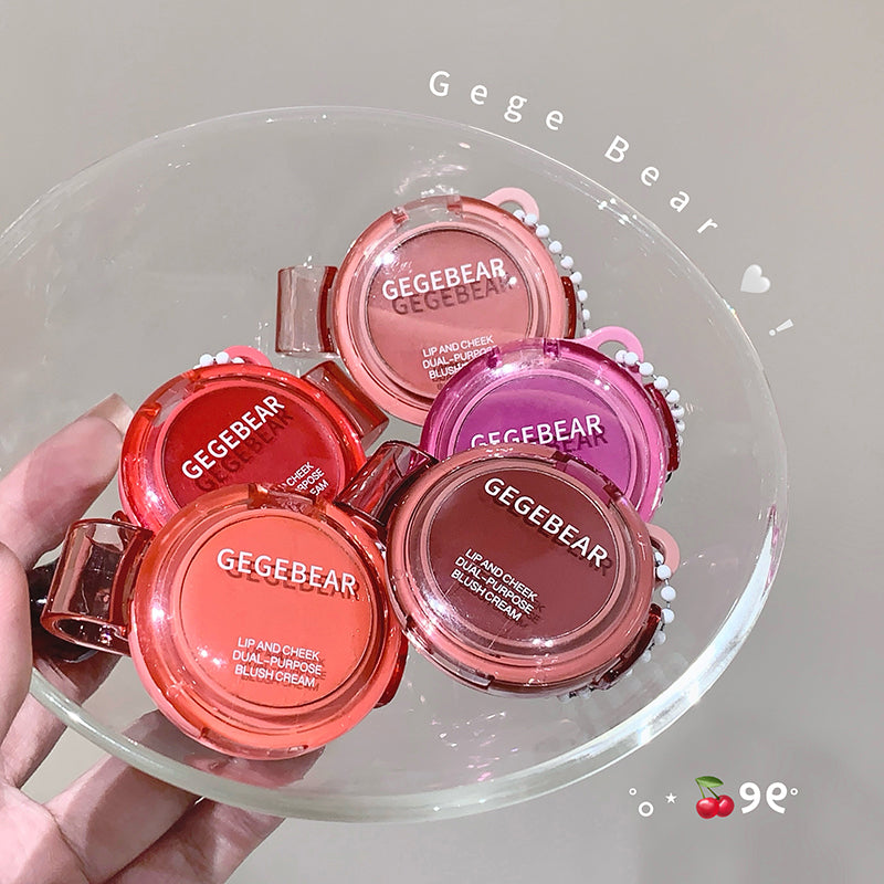 Collection of Gege Bear lip and cheek products on a clear dish.