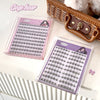 False eyelashes in pink and purple packaging with 'Gege bear' branding on a white surface.