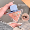 Makeup product with 'Gege bear' branding held by a hand, close-up of eye makeup application.