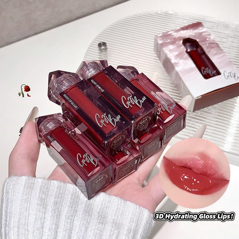 Red lip glosses with 'Gotta Glow' branding held in a hand, close-up of gloss on lips, and product packaging.