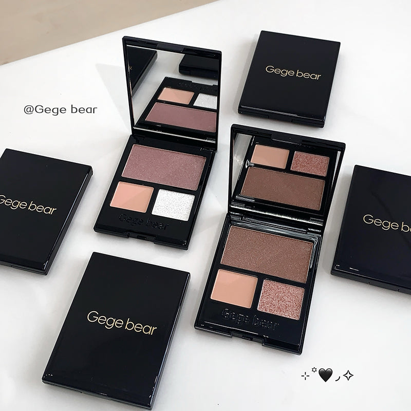 Makeup palettes with 'Gege bear' branding on a white surface