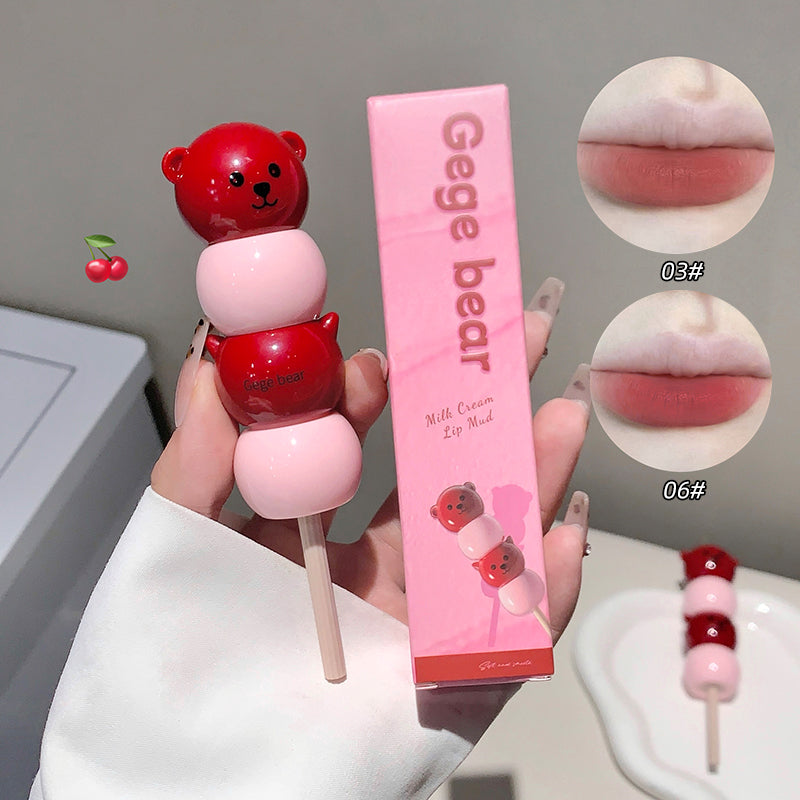 Lip balm with bear design and pink packaging labeled 'Gege bear' held by a hand.